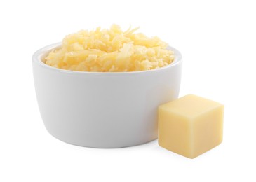 Photo of Grated cheese in bowl and piece of one isolated on white