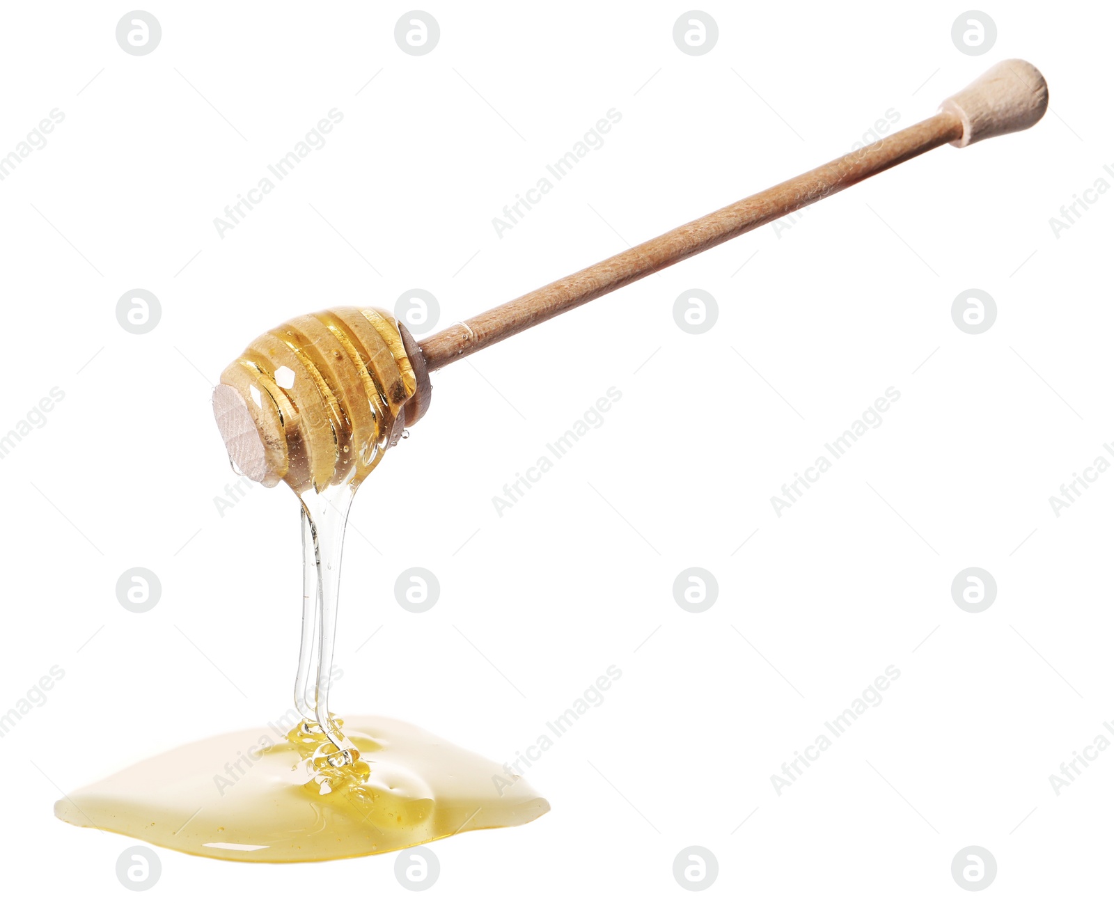 Photo of Natural honey dripping from dipper on white background