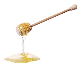 Natural honey dripping from dipper on white background