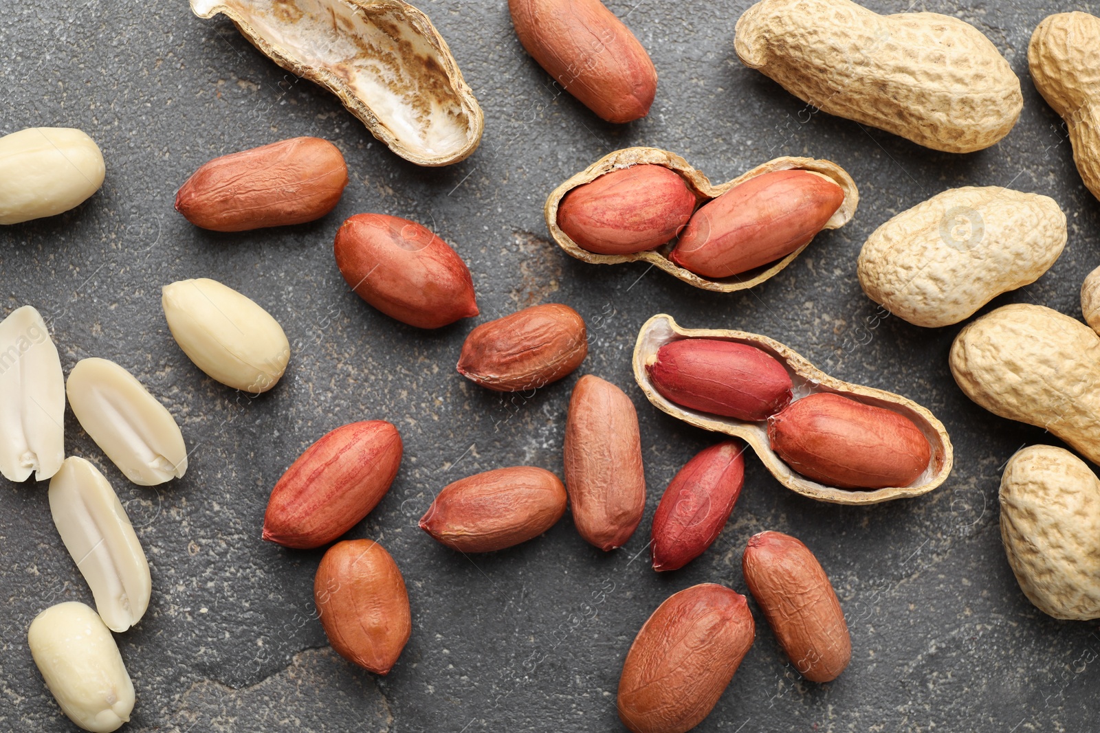 Photo of Fresh peanuts on grey table, flat lay