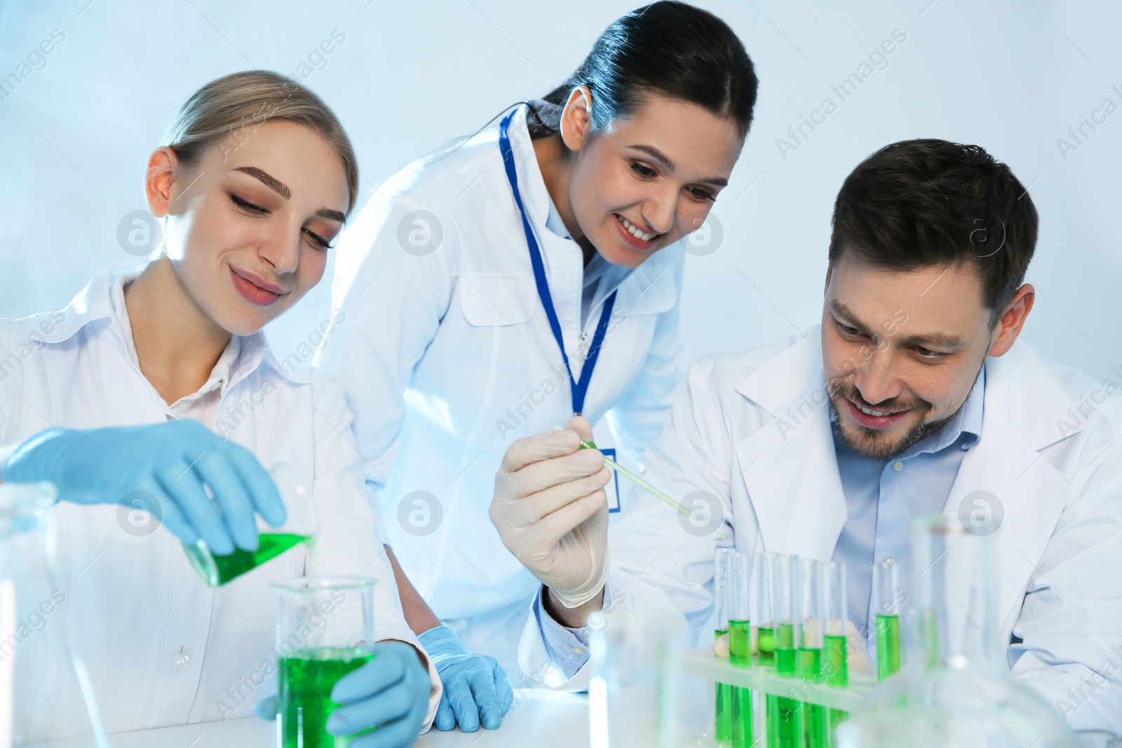 Photo of Group of scientists working in modern chemistry laboratory