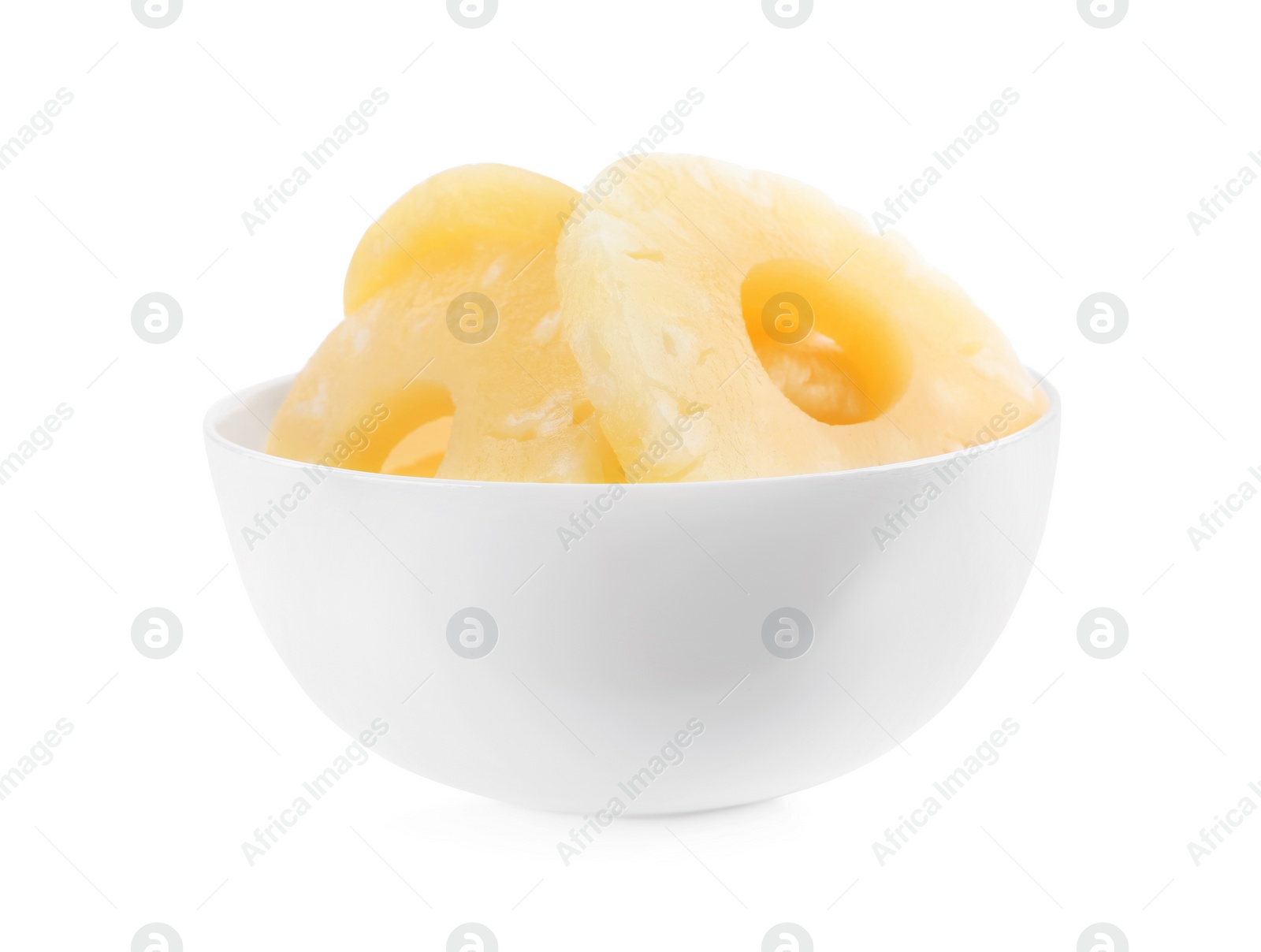 Photo of Delicious canned pineapple rings in bowl on white background