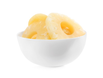 Photo of Delicious canned pineapple rings in bowl on white background