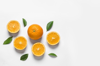 Photo of Composition with ripe oranges on white background, top view