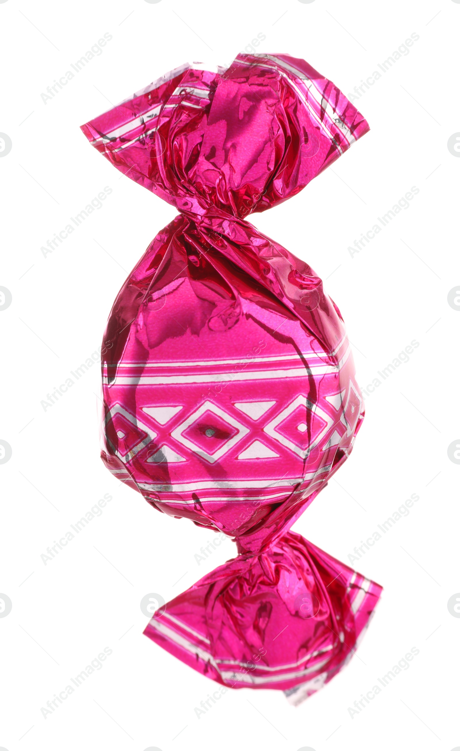 Photo of Candy in bright pink wrapper isolated on white