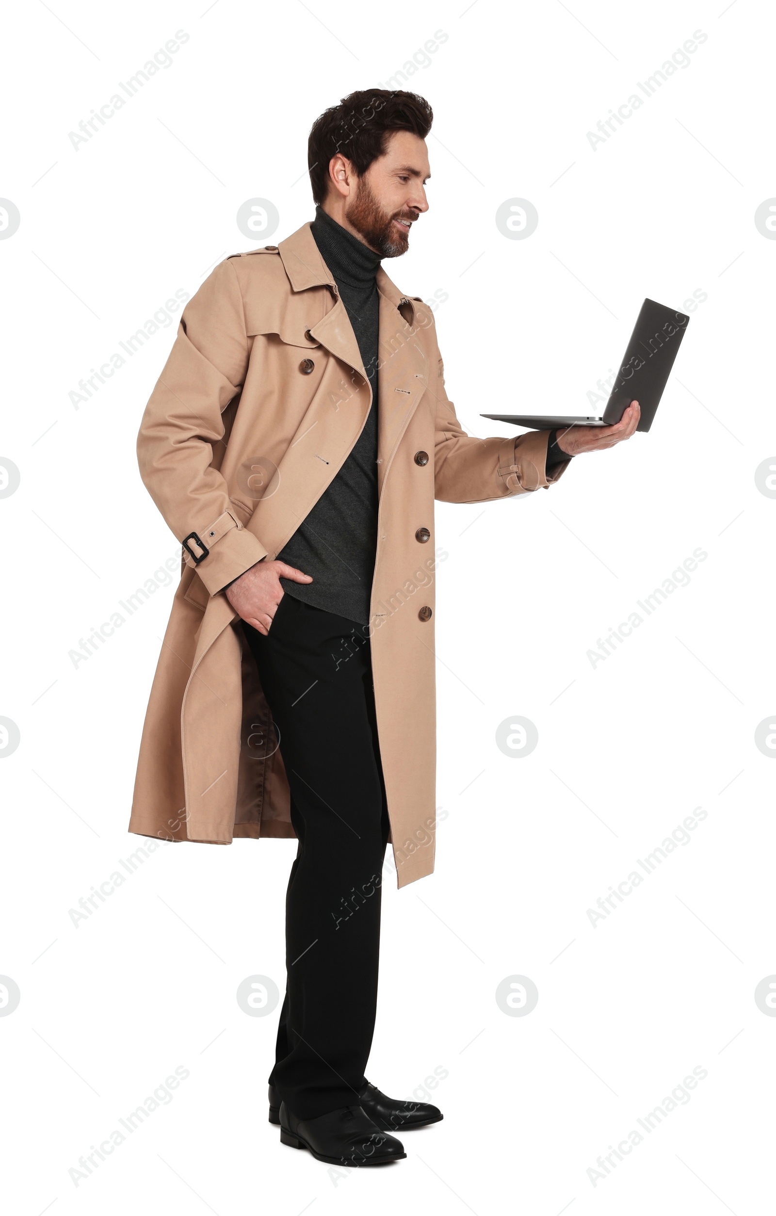 Photo of Handsome man with laptop on white background