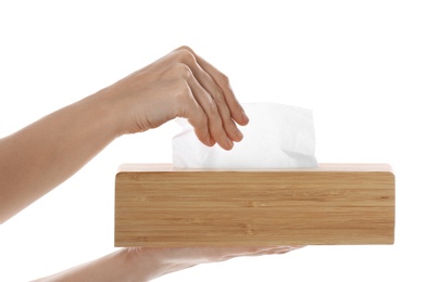 Photo of Woman taking paper tissue from holder on white background, closeup