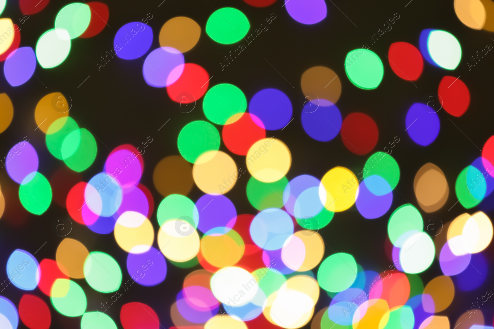 Photo of Beautiful colorful lights on dark background. Bokeh effect