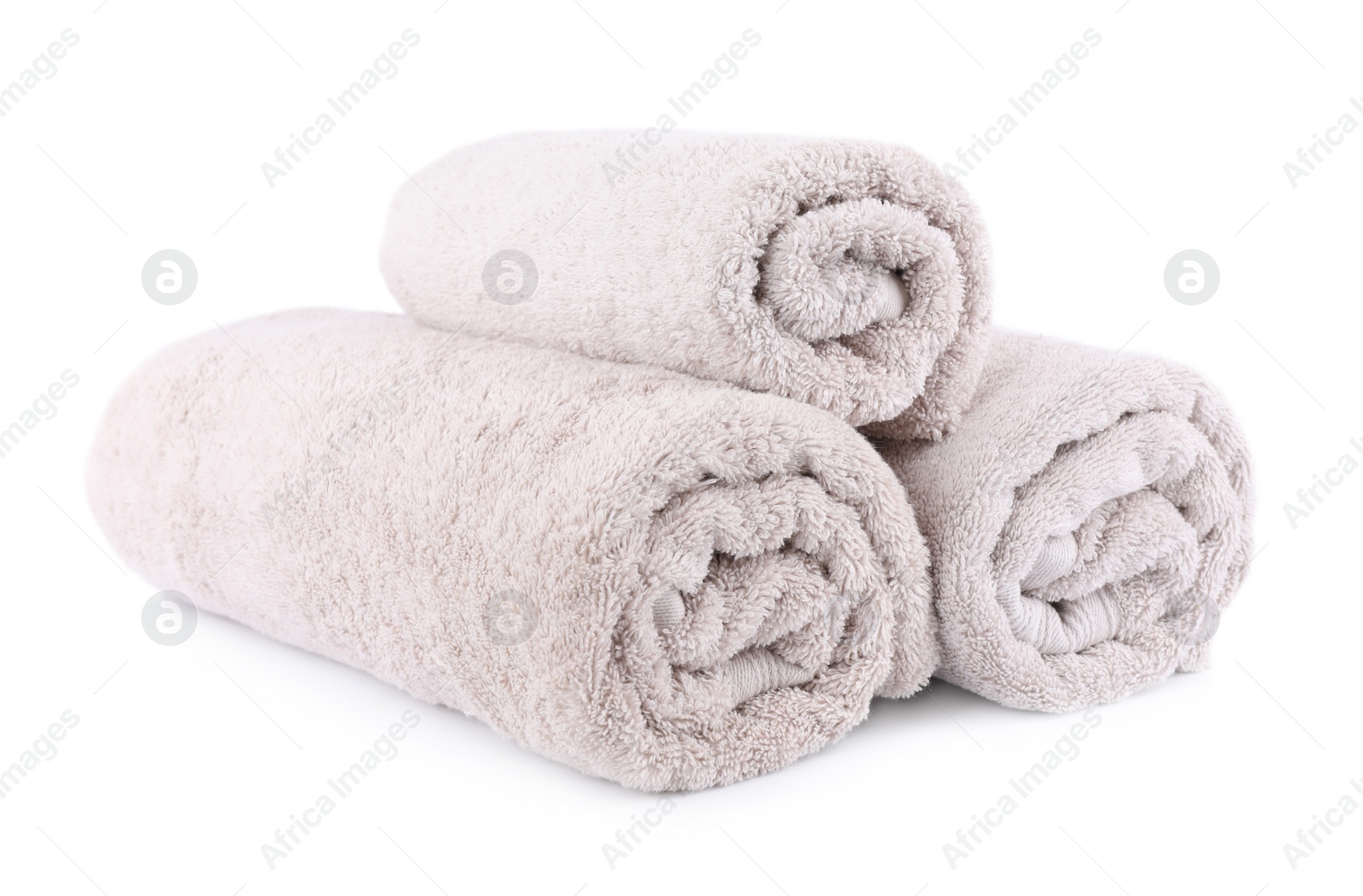 Photo of Rolled soft terry towels isolated on white