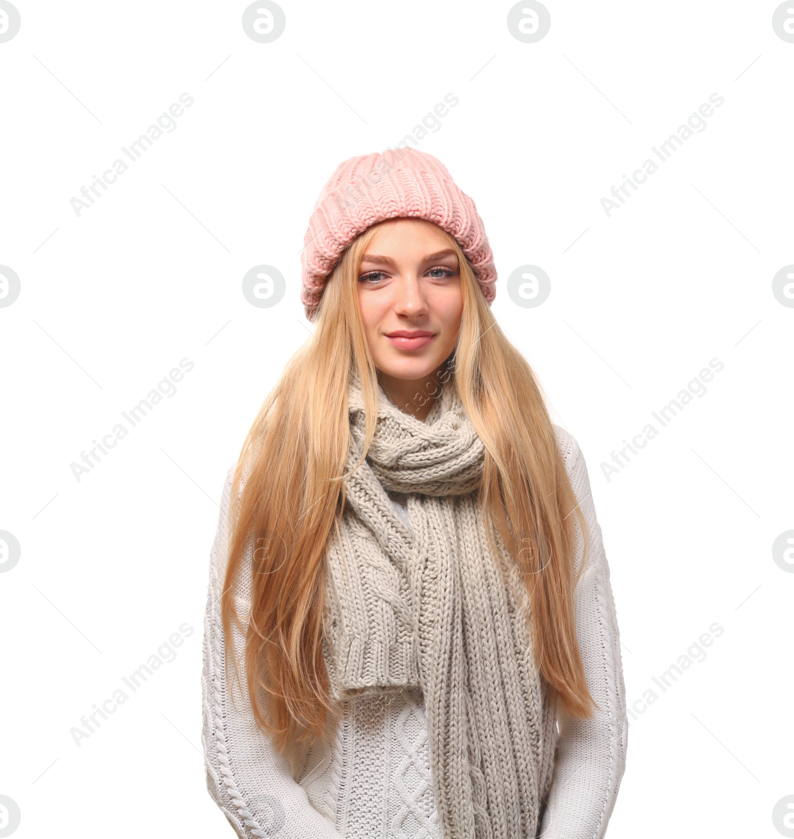 Photo of Portrait of beautiful young woman in stylish hat and sweater with scarf on white background. Winter atmosphere