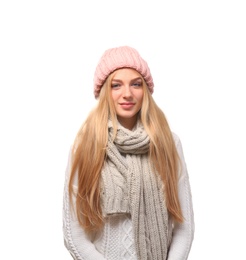 Portrait of beautiful young woman in stylish hat and sweater with scarf on white background. Winter atmosphere