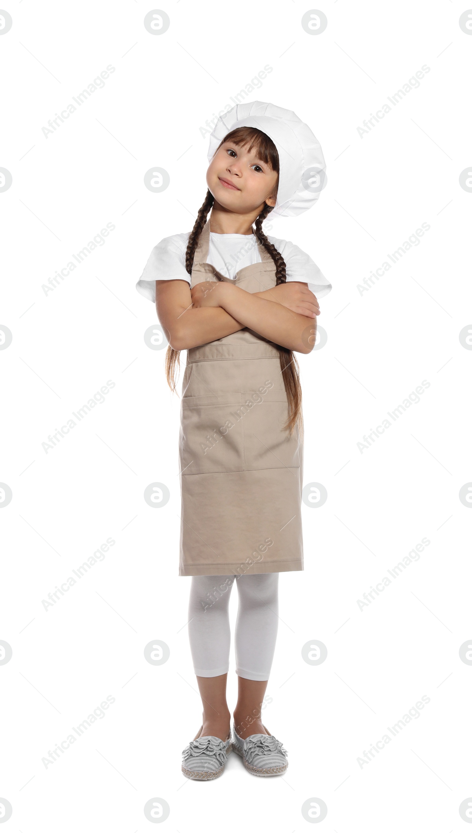 Photo of Full length portrait of little girl in chef hat on white background