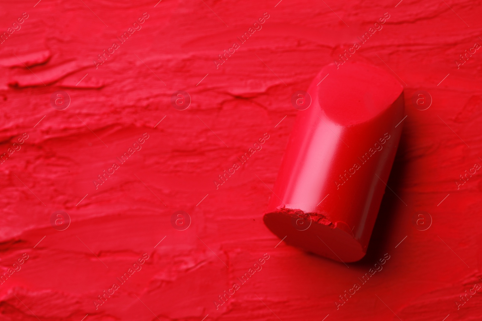 Photo of Beautiful bright red lipstick , above view