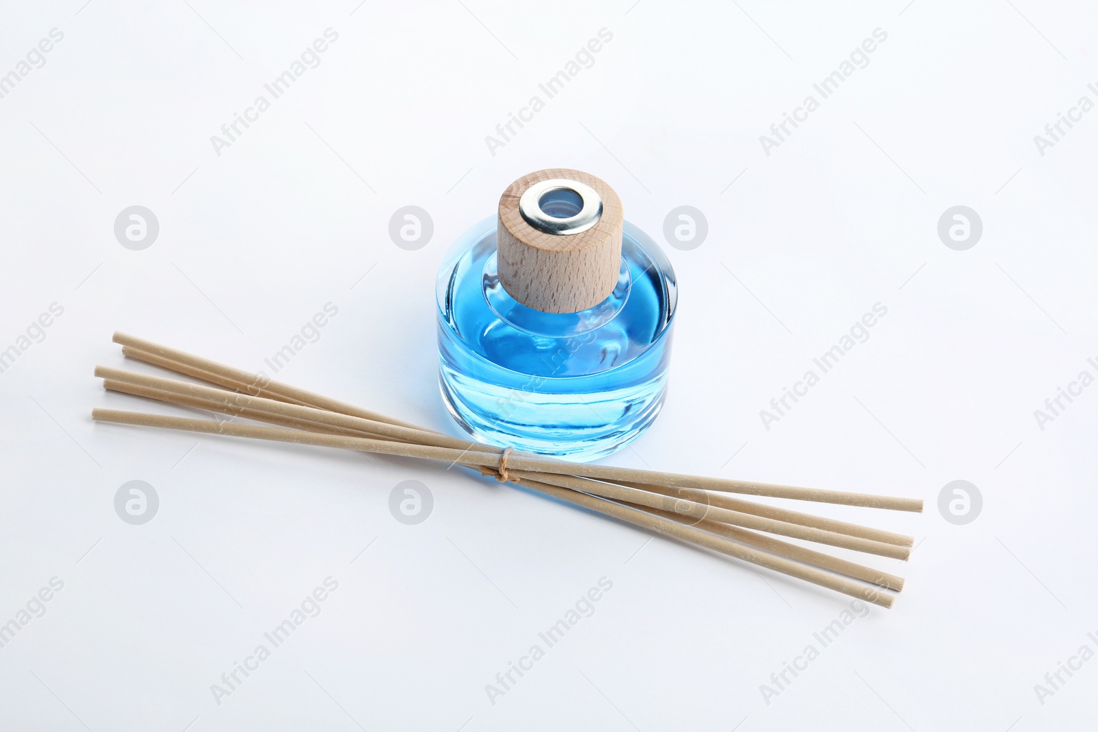 Photo of New reed air freshener on white background