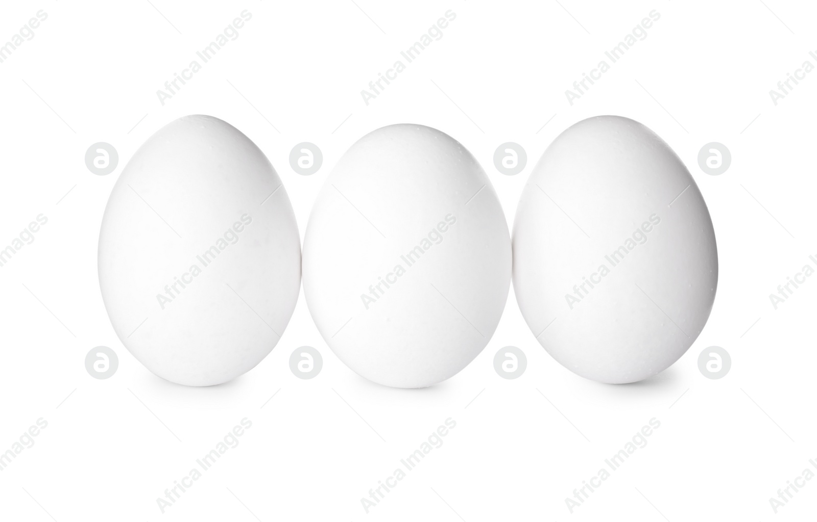 Photo of Fresh raw chicken eggs on white background