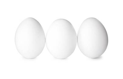 Photo of Fresh raw chicken eggs on white background