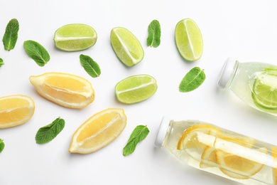 Photo of Flat lay composition with delicious natural lemonade on white background