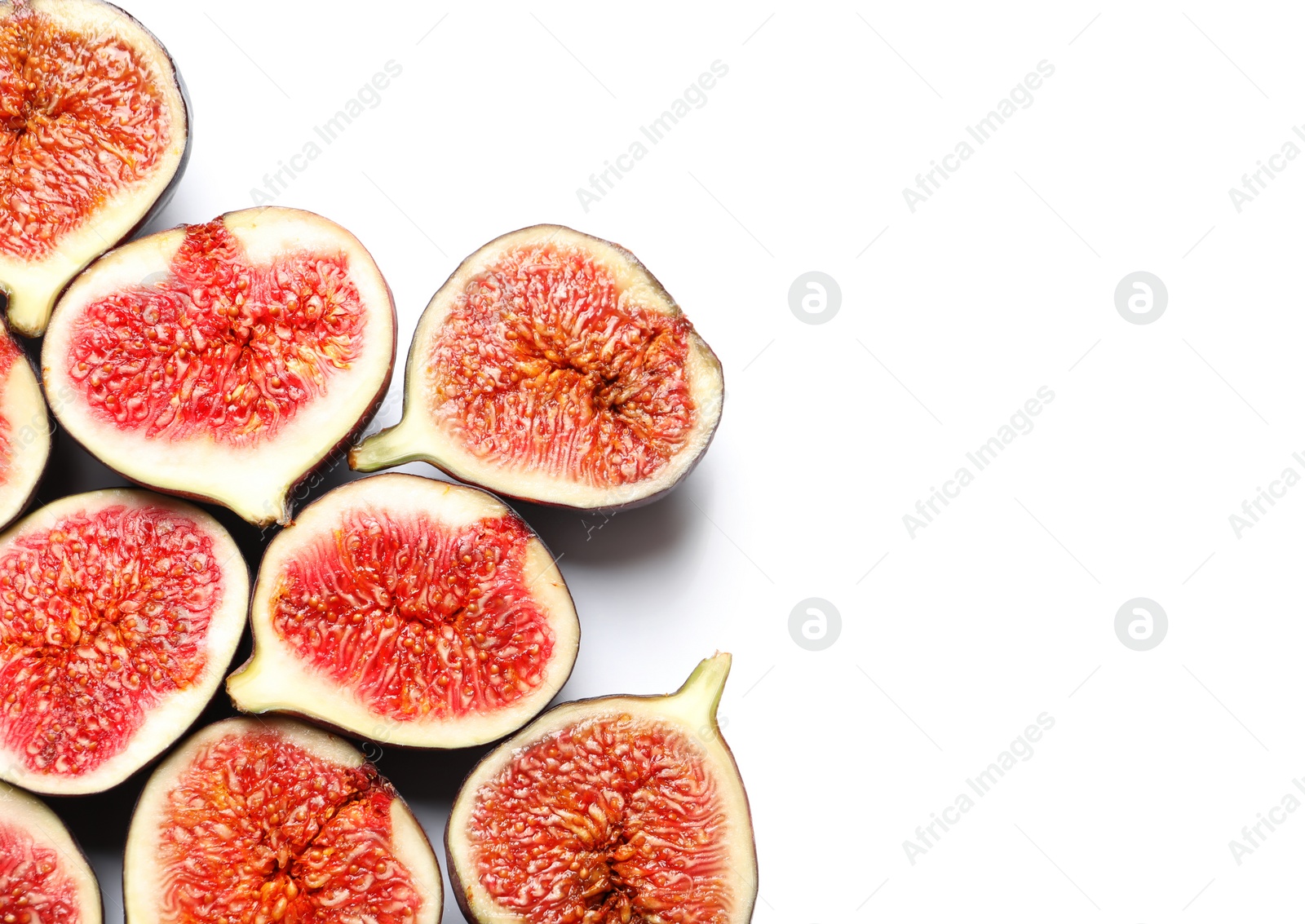 Photo of Cut ripe figs on white background, top view