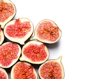 Photo of Cut ripe figs on white background, top view