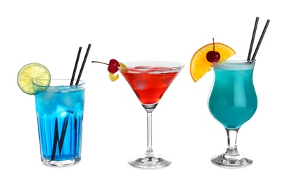 Photo of Tasty refreshing cocktails in glasses on white background