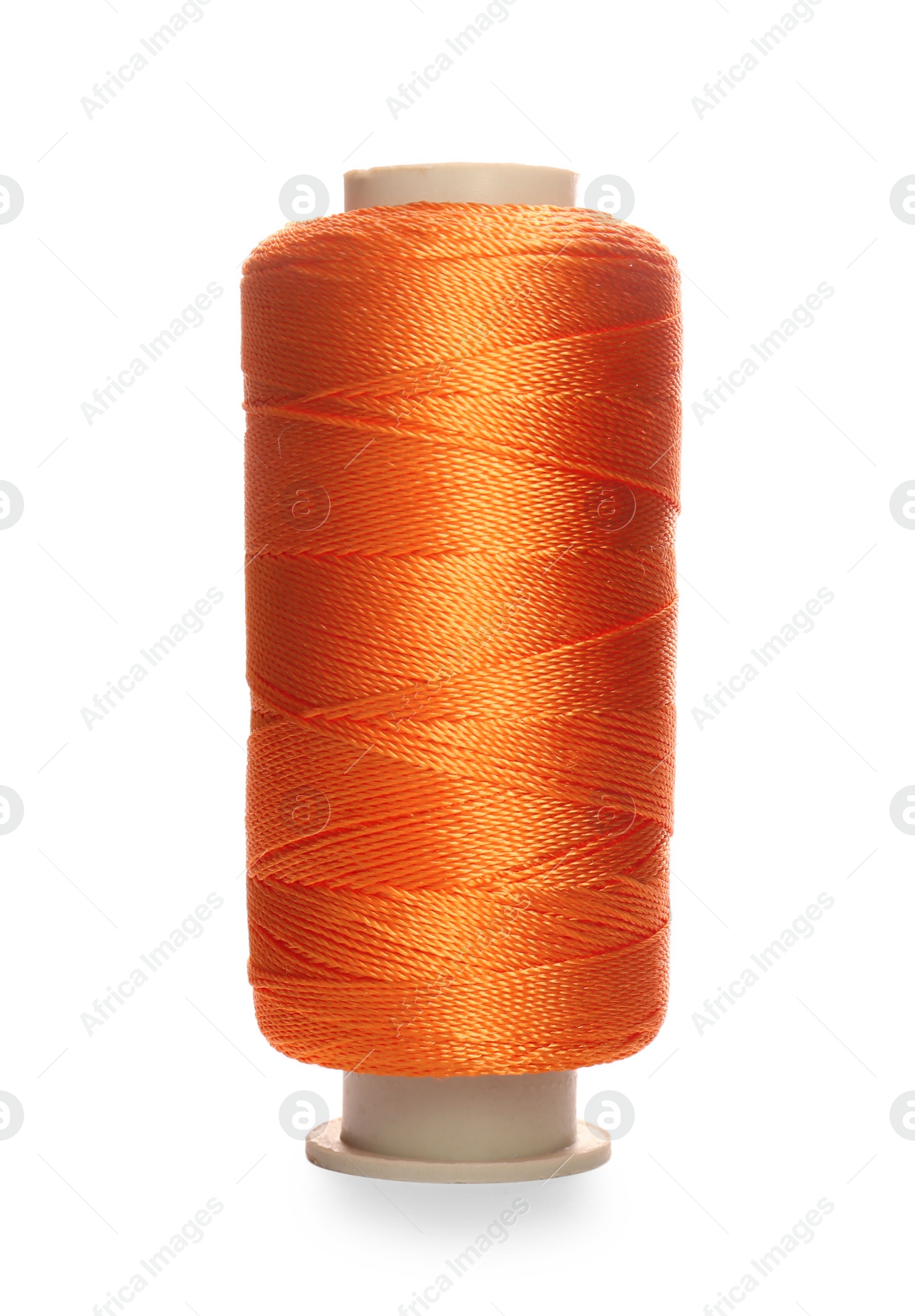 Photo of Spool of orange sewing thread isolated on white