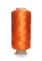 Photo of Spool of orange sewing thread isolated on white