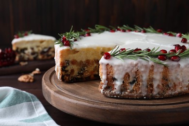 Traditional homemade Christmas cake on wooden table, closeup