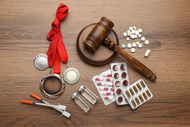 Photo of Flat lay composition with drugs on wooden table. Doping control