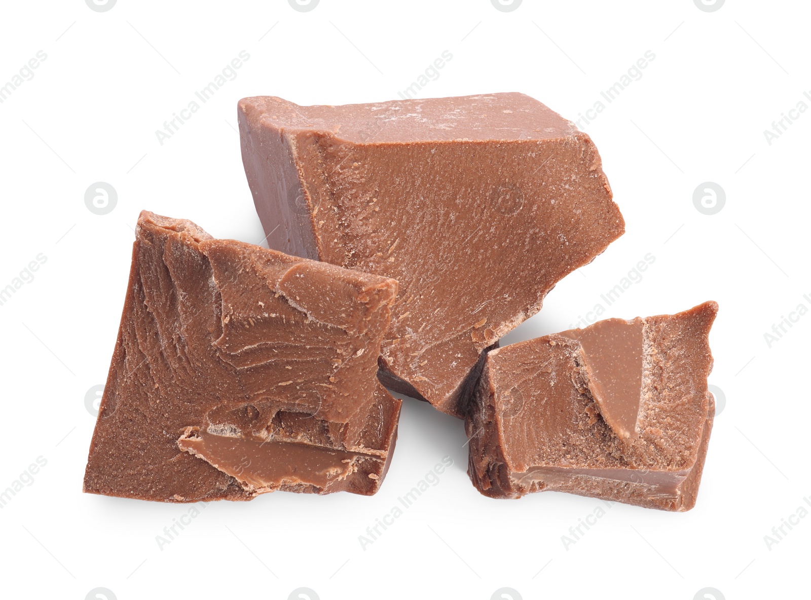 Photo of Pieces of tasty milk chocolate isolated on white, top view