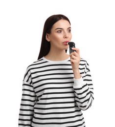 Photo of Woman blowing into breathalyzer on white background