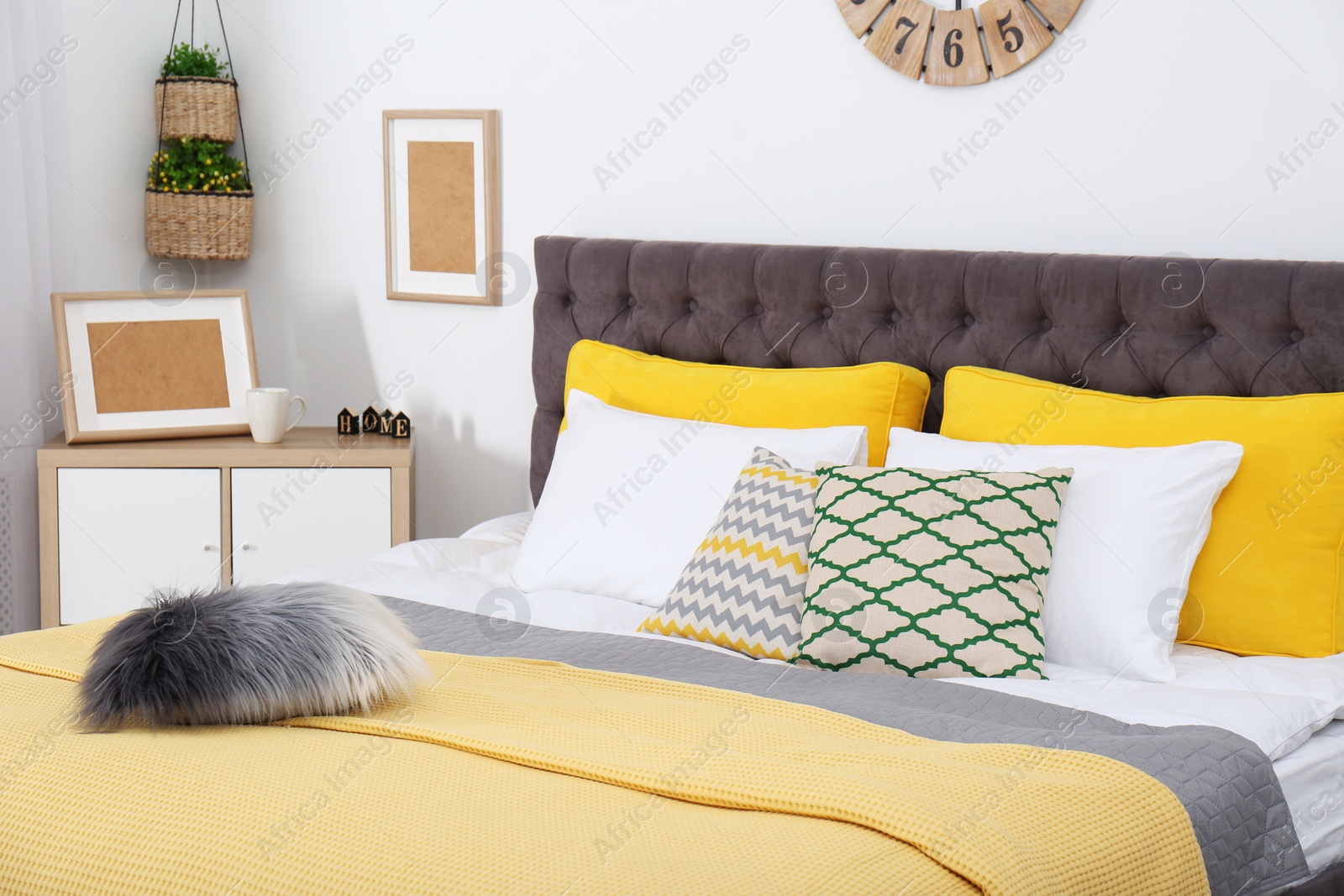 Photo of Stylish room interior with large comfortable bed