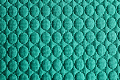 Photo of Textured turquoise fabric as background, closeup view