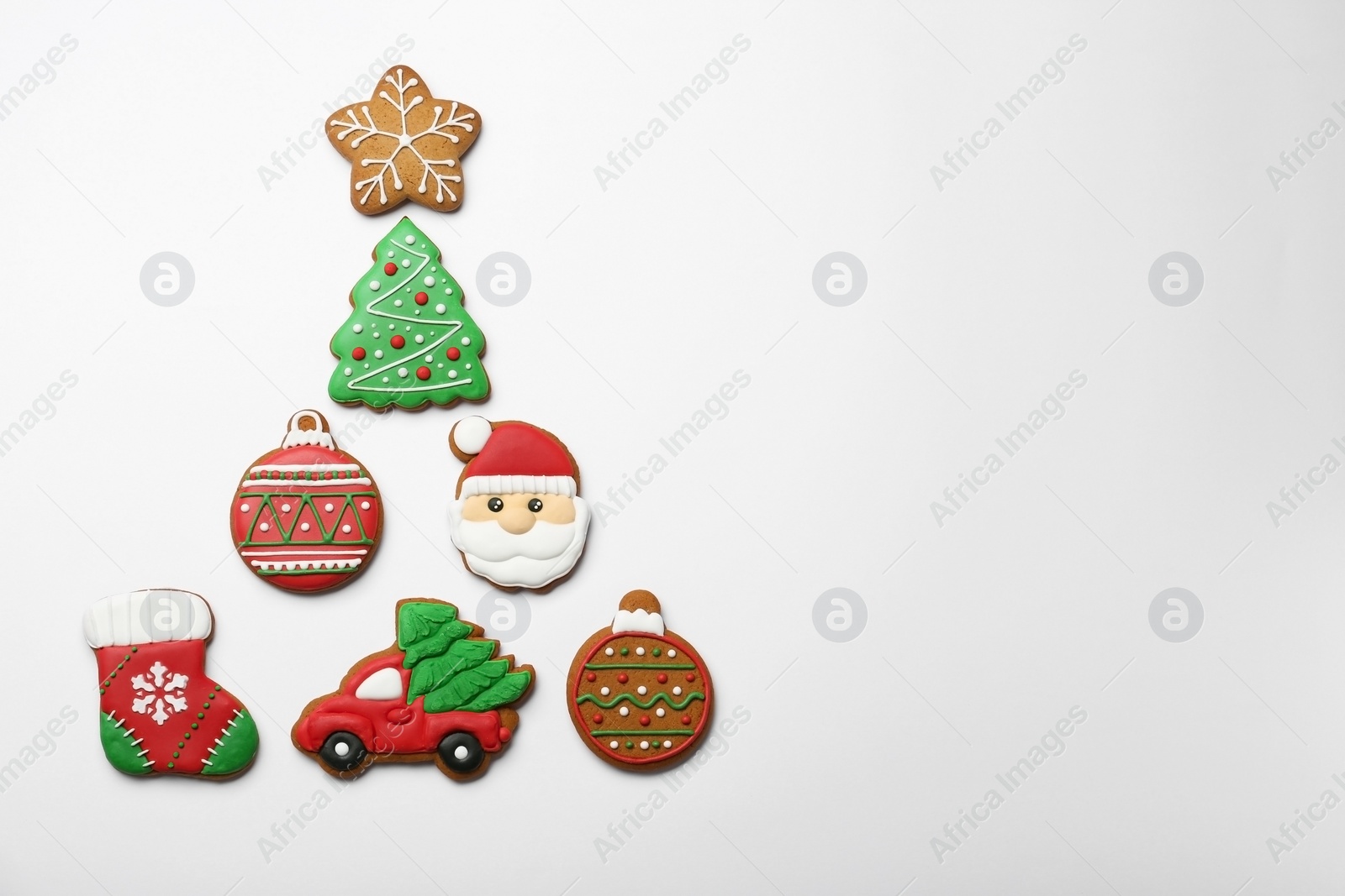 Photo of Different tasty Christmas cookies on white background, flat lay. Space for text