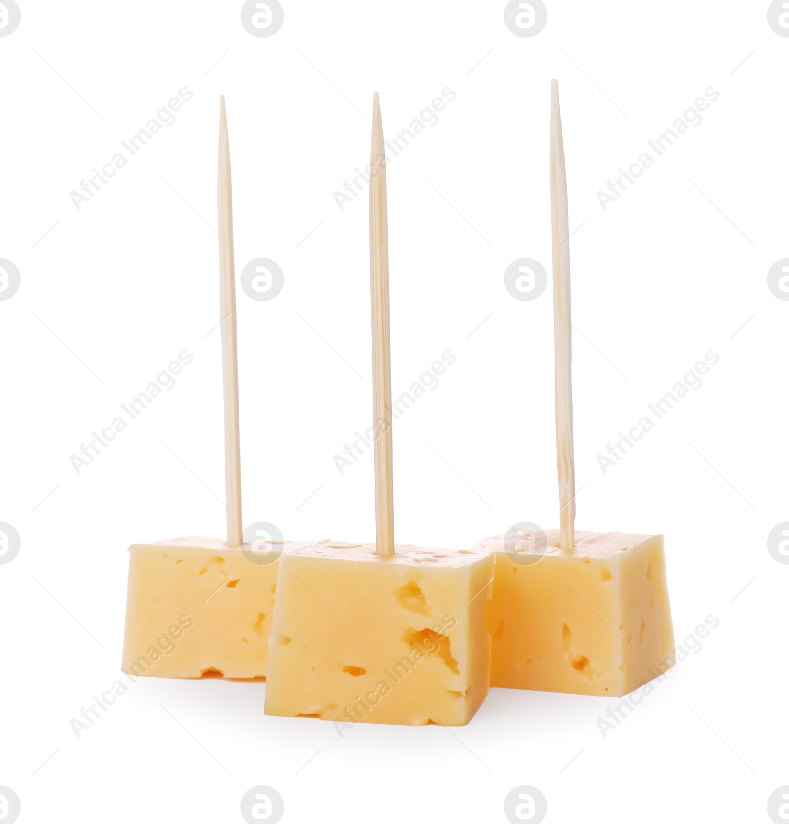Photo of Toothpick appetizers. Tasty cheese pieces on white background