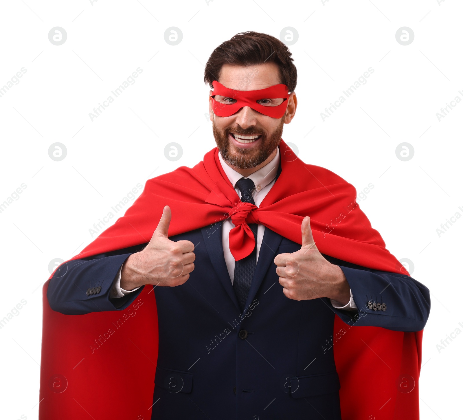 Photo of Happy businessman in red superhero cape and mask showing thumbs up on white background