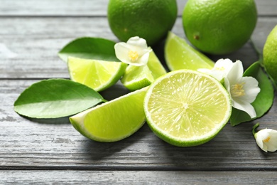 Fresh ripe limes on wooden table. Citrus fruit