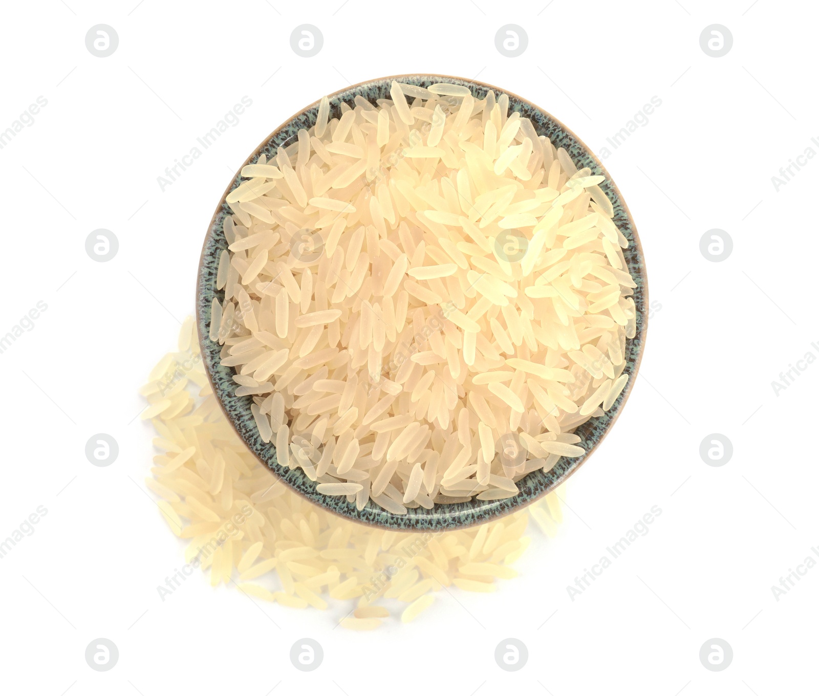 Photo of Raw rice in bowl isolated on white, top view