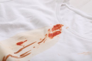 Photo of White shirt with stain of sauce, closeup