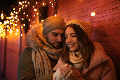 Photo of Happy couple spending time at Christmas fair
