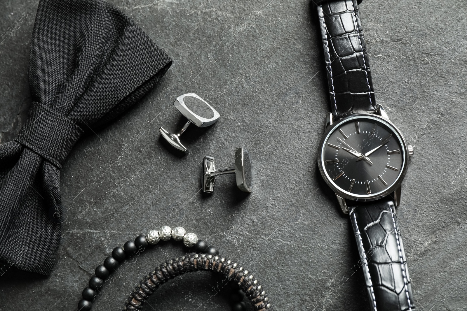 Photo of Flat lay composition with luxury wrist watch on black background