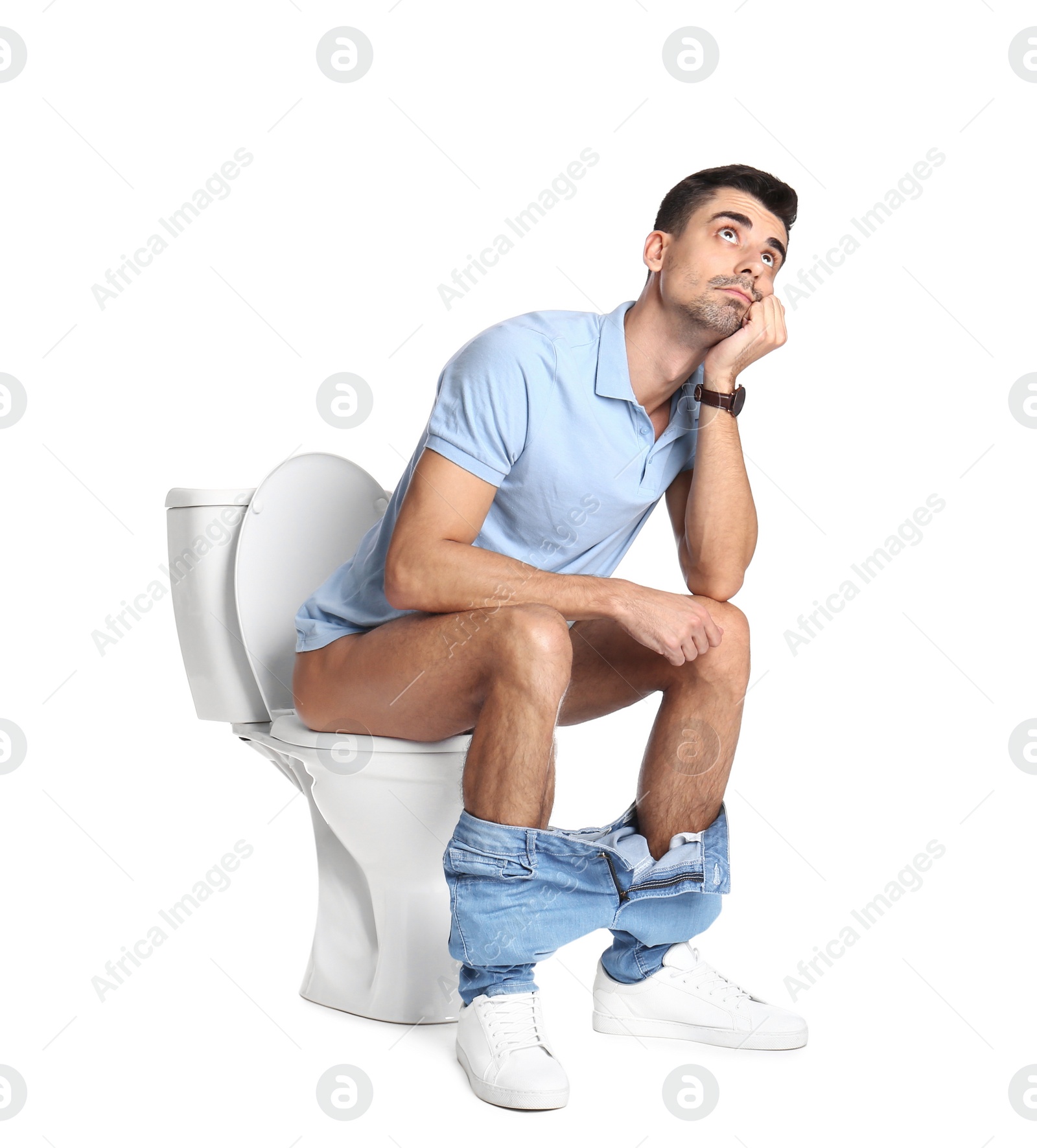 Photo of Man sitting on toilet bowl, white background