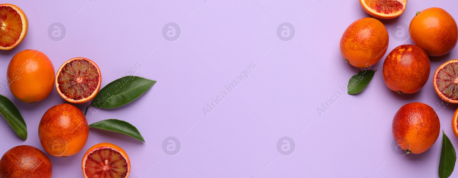 Image of Many ripe sicilian oranges and leaves on violet background, flat lay with space for text. Banner design