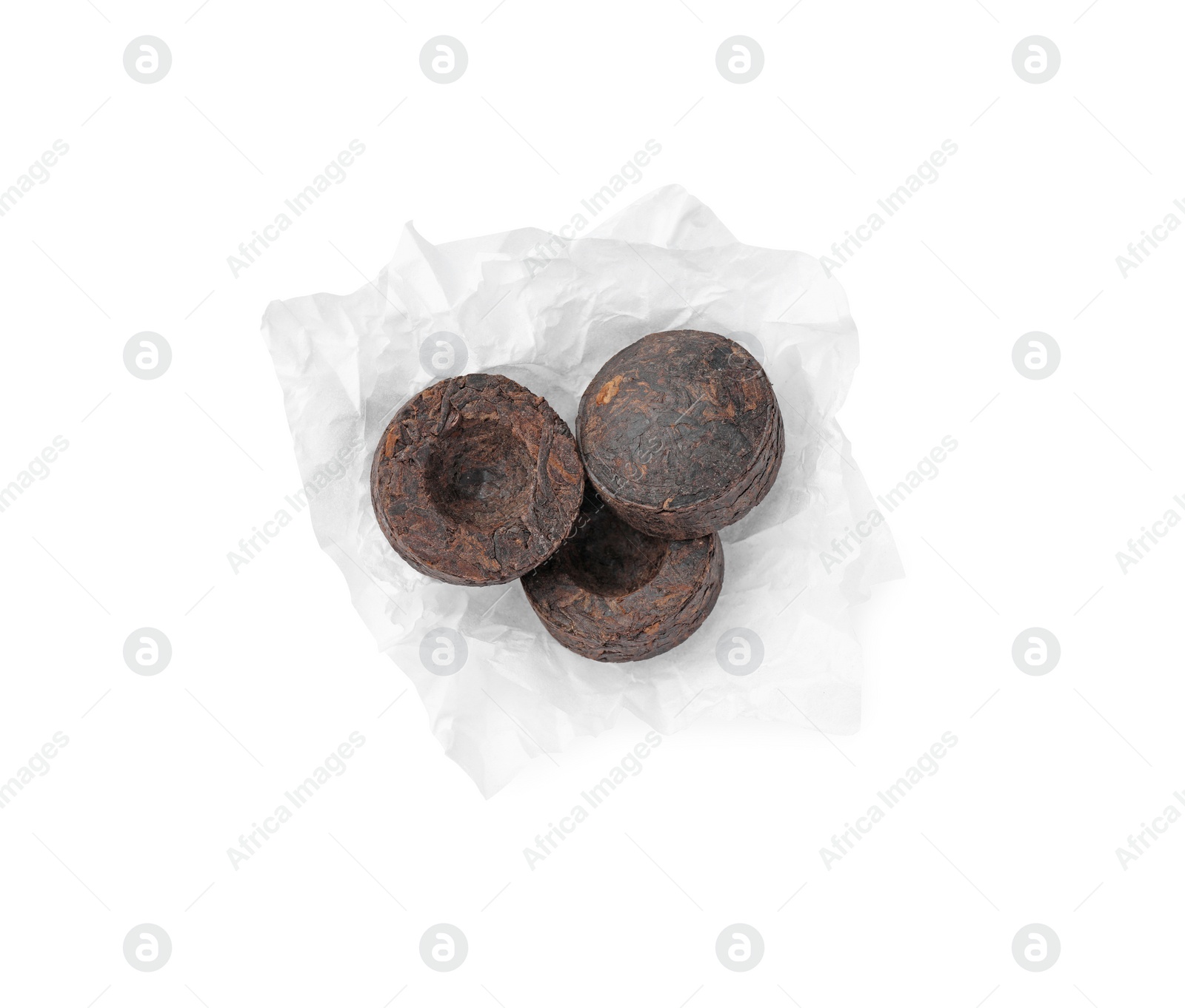 Photo of Cake shaped traditional Chinese pu-erh tea isolated on white, top view