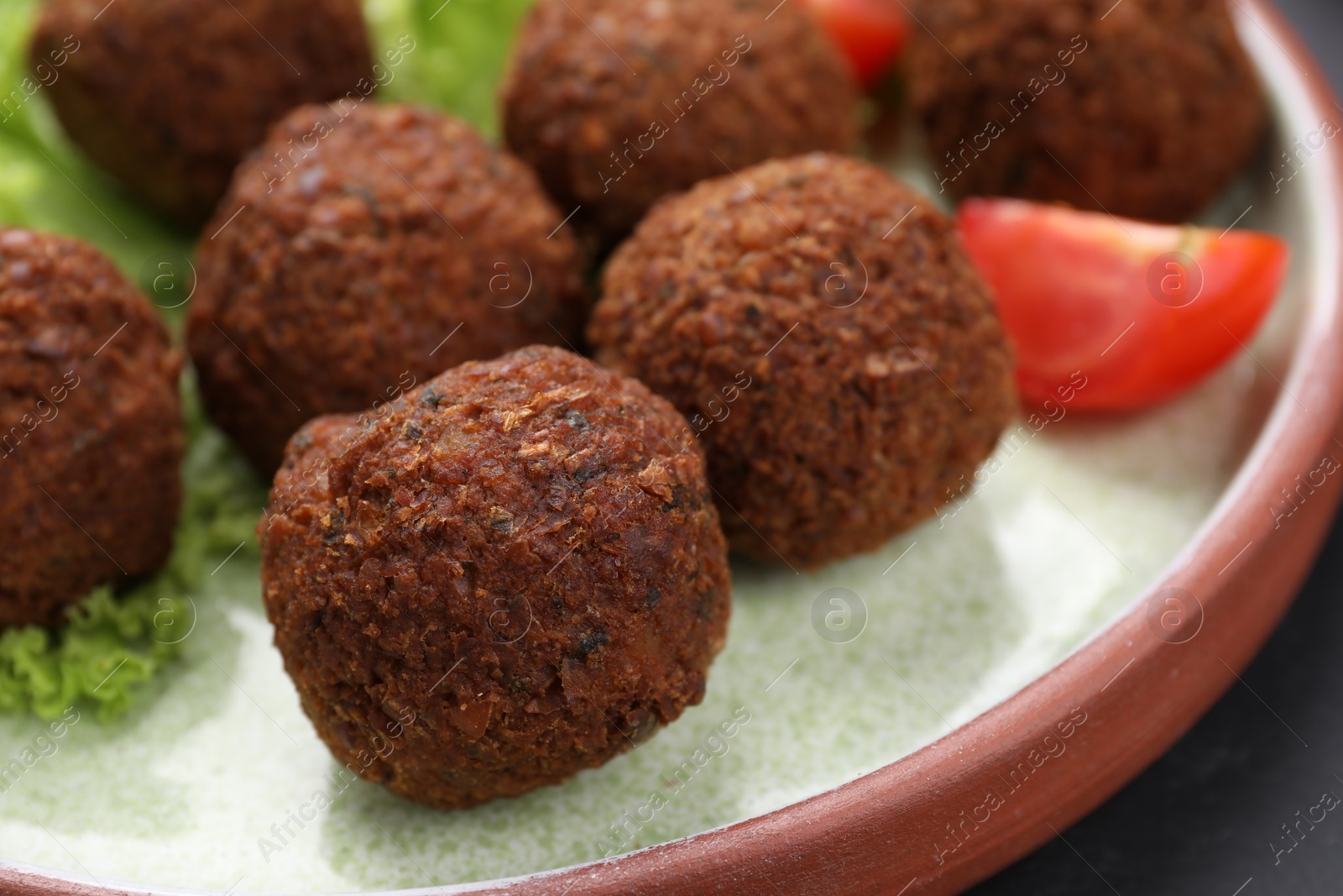 Photo of Delicious falafel balls on plate, closeup. Vegan meat products