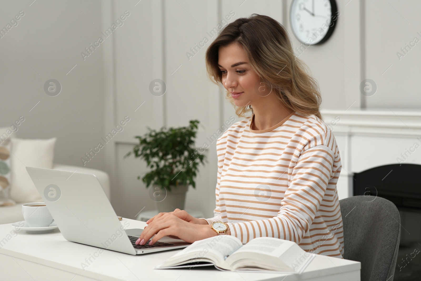 Photo of Online test. Woman studying with laptop at home