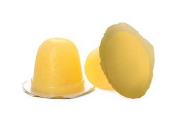 Photo of Delicious yellow jelly cups on white background