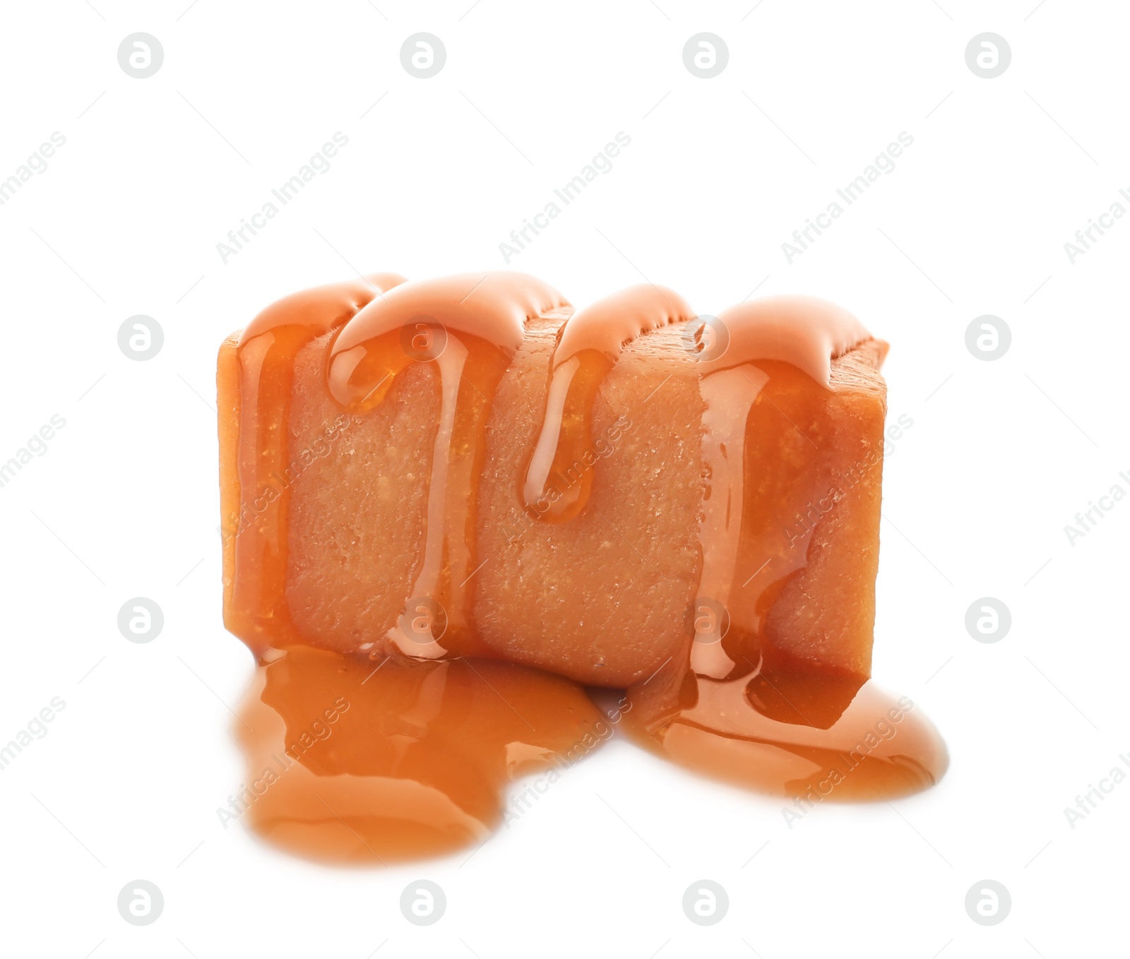 Photo of Delicious candy with caramel sauce on white background