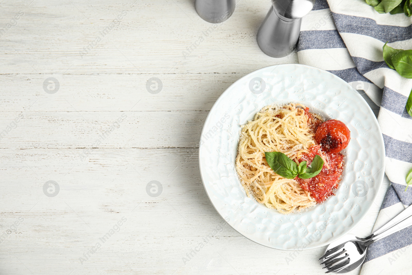 Photo of Flat lay composition with tasty pasta on white wooden table, space for text