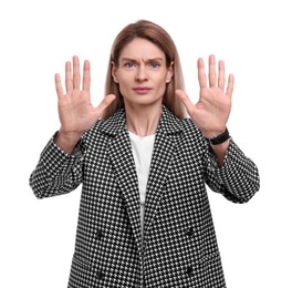 Beautiful businesswoman in suit posing on white background