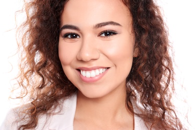 Young African-American woman with beautiful face on white background, closeup